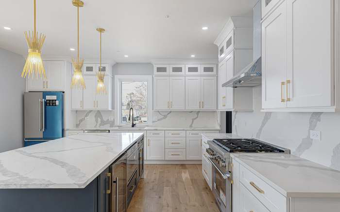 Kitchen remodeling white and blue and gold in Chicago